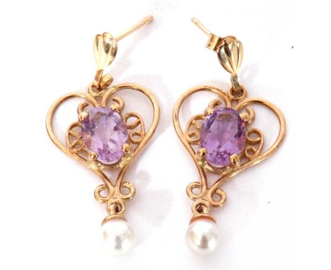 Pair of yellow metal, amethyst and seed pearl earrings, an open work design centring a small pale oval faceted amethyst withi