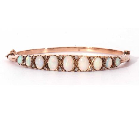 Antique opal and diamond hinge bracelet, the top section raised with nine oval graduated cabochon opals and highlighted betwe