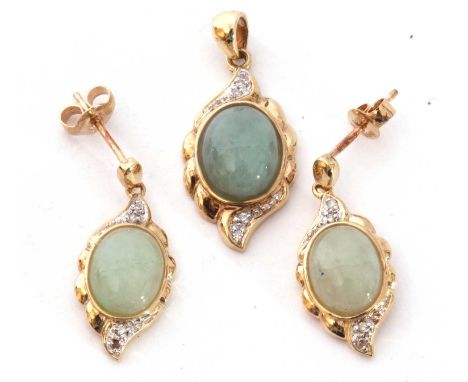 9ct gold, jade and diamond pendant, the pale celadon jade cabochon framed in a 9ct gold mount, highlighted below with two sma