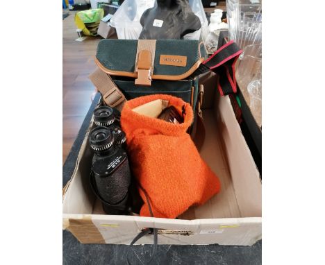 A box Pathescope binoculars, JVC compact video camera, and orange bag of attachments