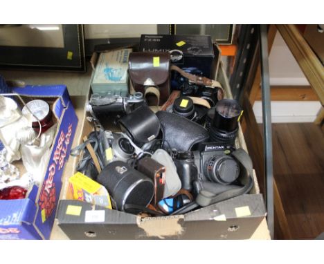 A box of vintage cameras and accessories to include Pentax and other makes