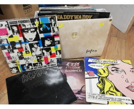 A case of vintage records to include an ACDC 'Back in Black' Atlantic record