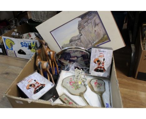 A box of embroidered dressing table set, light up Santa ornaments, costume jewellery, and a watercolour of 'On The Rocks' by 