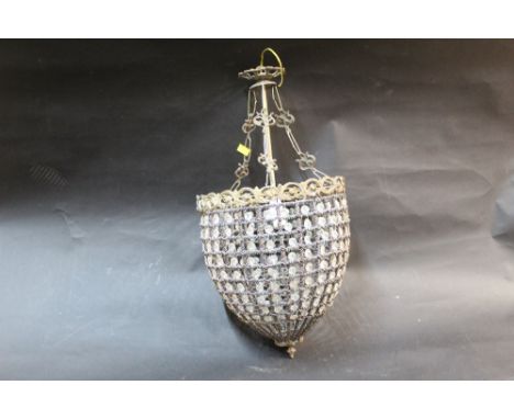 A gilt metal ceiling light fitting with glass bead decoration