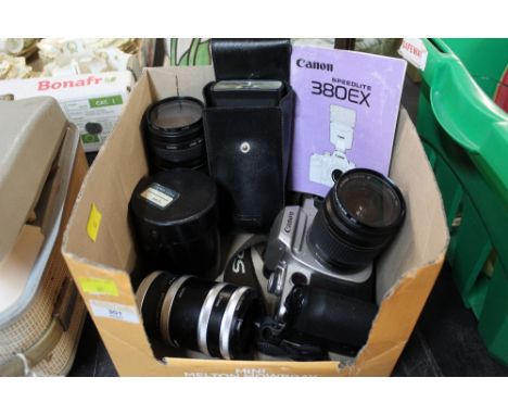 A Canon EOS 50E digital camera together with lenses and flash