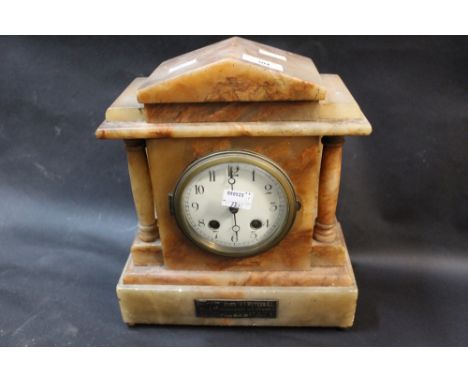 A Victorian marble mantle clock with applied plaque inscribed '... by the Parishioners of Distington'