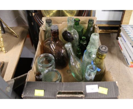 A box of vintage glass bottles to include chemist bottles and a Carlisle beer bottle