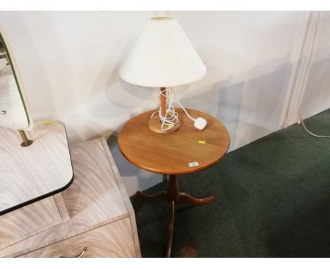 A circular pine tripod table and wooden table lamp with cream shade 