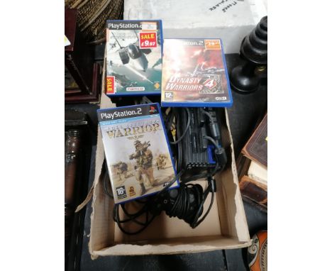 A Playstation 2 games console with controls and three games to include Dynasty Warriors and Full Spectrum Warrior