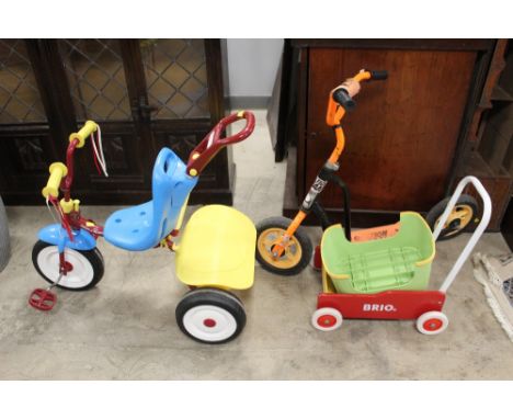 A child's Radio Flyer trike, an Action Man scooter, and a Brio cart