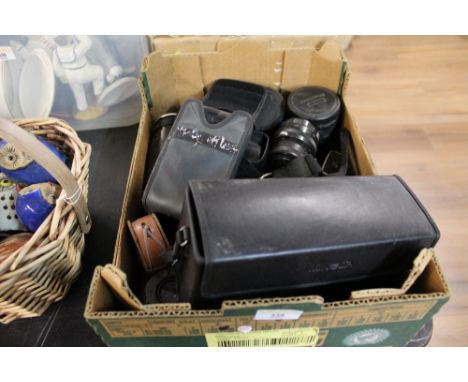 A box of vintage cameras and accessories, to include a Chinon camera and lenses 