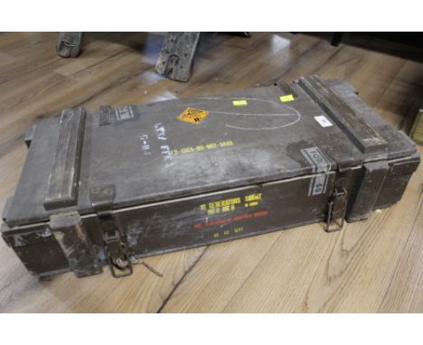 A vintage wooden ammunition box with divisions to interior