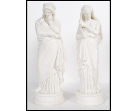 A pair of 20th Century ceramic blanc de chine classical figurines of two of the Greek muses, Melpomene and possibly Thalia, r