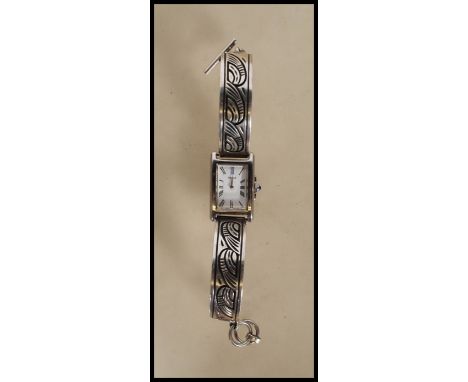 A vintage Pulsar water resistant ladies wrist watch having a rectangular face with white enamelled dial and Roman numeral cha