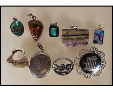 A&nbsp; selection of silver jewellery to include a stamped 925 silver antiquity brooch, an oval locket with engraved scrolled