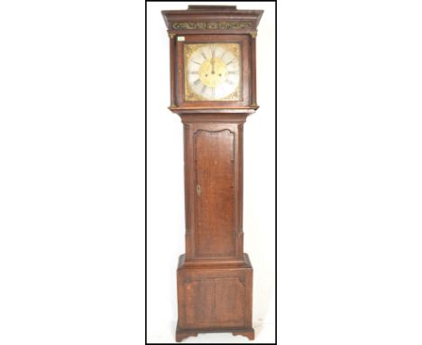 A 18th Century Georgian oak and mahogany cross banded eight-day brass faced, longcase clock. It has an eight-day movement on 