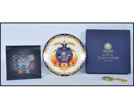 A collection of items to include a Royal Mint Commemorative plate by Royal Worcester commemorating the 50th anniversary of th