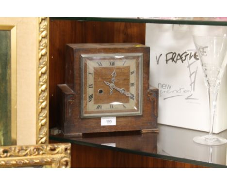 A OAK CASED MANTEL CLOCK 