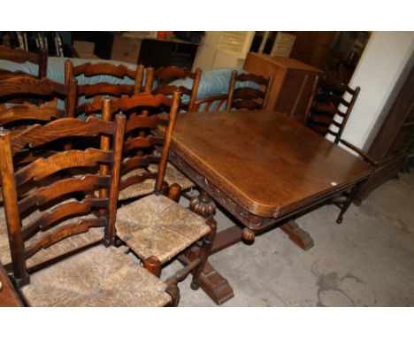 AN OAK DRAW LEAF TABLE TOGETHER WITH A SET OF EIGHT LADDER BACK CHAIRS INCLUDING ONE CARVER