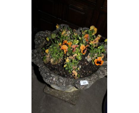 A STONE GARDEN PLANTER AND CONTENTS 