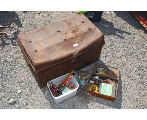 A metal trunk with contents including hand tools, tins, nails etc.