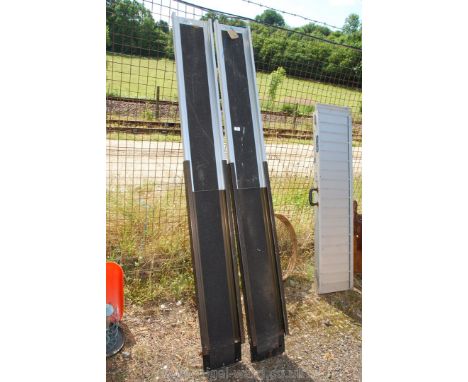 Pair of extending light weight ramps up to 80''.