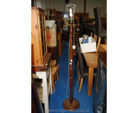 Turned wood standard lamp.