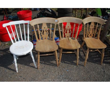 Three kitchen chairs and a painted stick back chair.