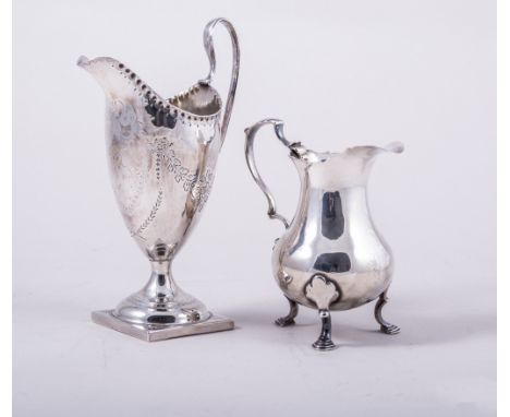 A George III silver helmet shape cream jug, by Benjamin Mountigue, London 1785, slender form, blank shield cartouche, engrave