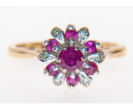A ruby and diamond circular cluster ring, a circular faceted ruby 4.5mm, claw set to centre and surrounded by rubies (6), 2mm