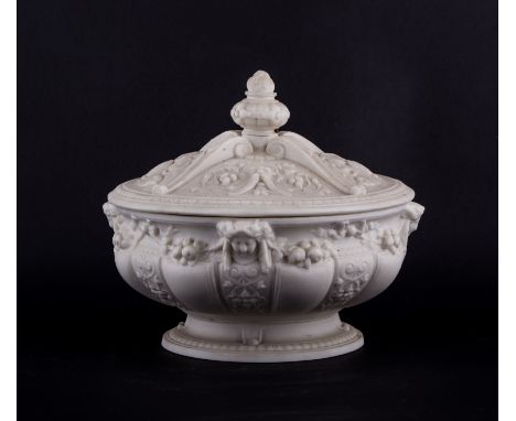 A Victorian Parian ware tureen on stand, registration mark for 1852, decorated in the Renaissance style with mask heads and f