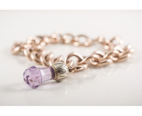 A rose metal hollow curb link bracelet, 12mm wide, fitted with a large bolt ring fastener with faceted amethyst fob attached,