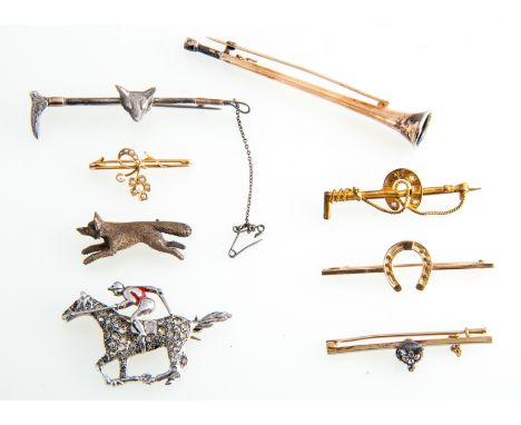 A collection of eight Victorian and Edwardian stock pins and bar brooches,
50mm long yellow metal bar with diamond set fox he