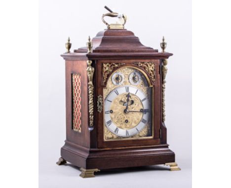 A Late Victorian  mahogany bracket clock, in the Georgian style, moulded hood and plinth base, brass urn finials, caryatid co