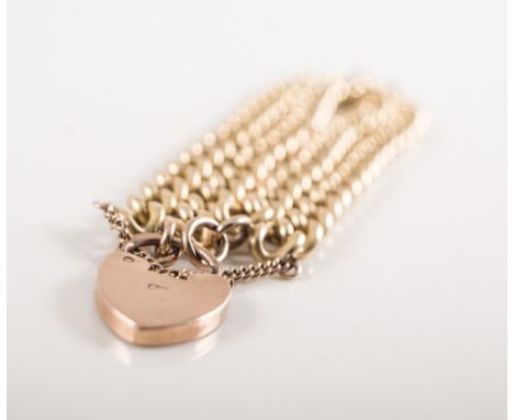 An 18 carat yellow gold bracelet, two row solid curb link chain 10mm wide and fitted with a 9 carat rose gold padlock fastene