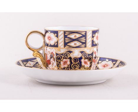 A Royal Crown Derby bone china coffee can and saucer, 1911, decorated with flower baskets in an Imari palette, No. 3788, an O