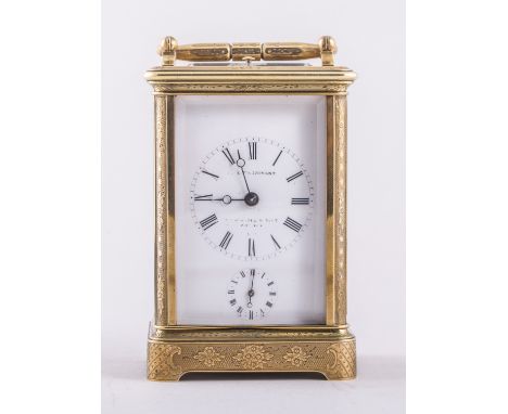 A French gilt brass carriage clock, with engraved foliate and scrolled decoration, white enamel dial, faintly signed J le Cle