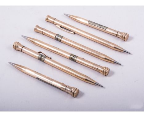 Three pairs of gold filled Eversharp pencils, one pair having plain polished circular barrels, 13cm long, another pair having