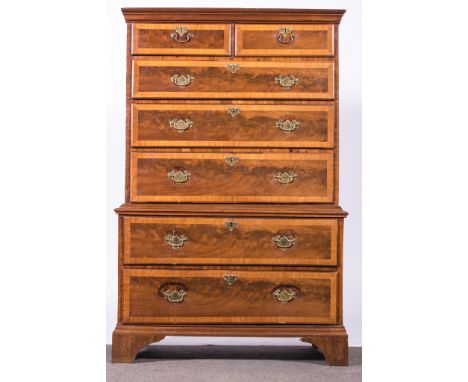 A George II style walnut and oak chest on chest, adapted, moulded cornice, fitted with two short and three long drawers to th
