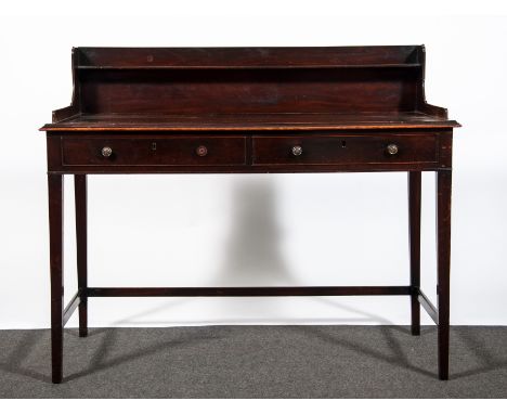 A George IV mahogany wash stand, rectangular top with a three quarter gallery incorporating a low shelf, fitted with two frie