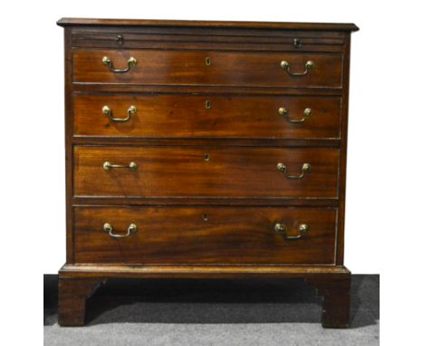 A George III mahogany chest of drawers, rectangular top with an ogee moulded edge fitted with a brushing slide over four grad