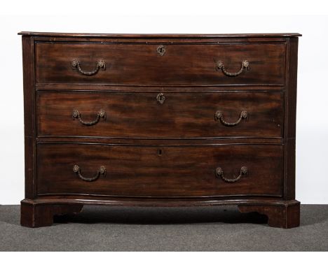 A George III mahogany serpentine chest of drawers, fitted with three deep long drawers, fluted canted corners, bracket feet, 