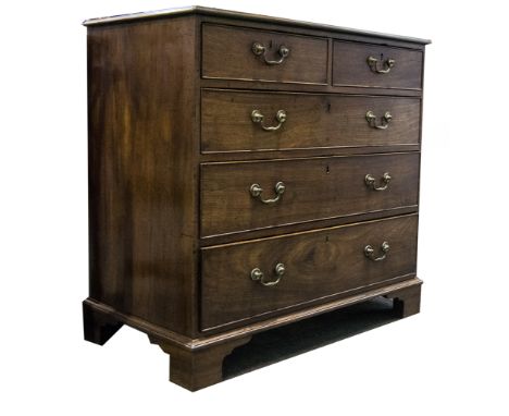 A George III mahogany chest of drawers, rectangular top with a moulded edge, two short and three long graduating drawers with