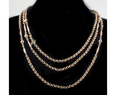 A Victorian yellow metal guard chain, a hollow 3.7mm circular belcher link chain spaced by pairs of faceted bars and central 