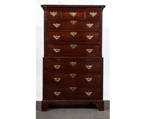 A George III mahogany chest on chest, dentil and cavetto moulded cornice, upper section with three short and three long drawe