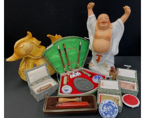 A carved Chinese stone seal stamp, foe dog top, others Oxon, mythical beast calligraphy set etc part boxed;  a large figure a