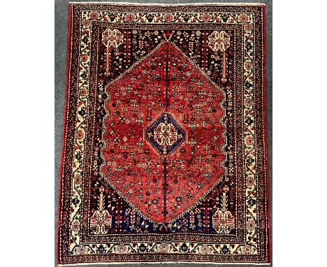 A South West Persian Abadeh rug / carpet, hand-knotted with intricate pattern of abstract motifs, within a field of stylised 