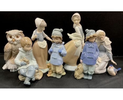 Nao by Lladro including; owl, boy with rabbit, girl with butterfly; etc (8) 