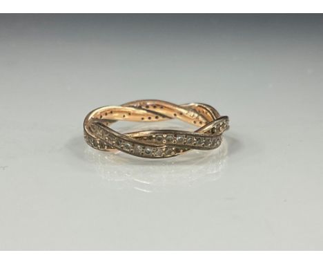 A white stone possibly sapphire twisting interconnected double layer eternity ring, white and rose metal shank, stamped ALE R