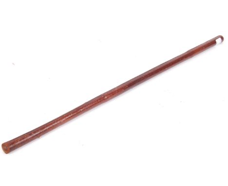 A WWI First World War tan leather bound swagger stick having a stepped taper and fine stitching to one side, top and bottom. 